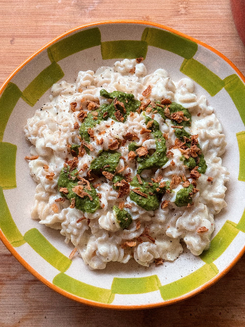 One pot mac and cheese topped with pickled jalapeno salsa verde